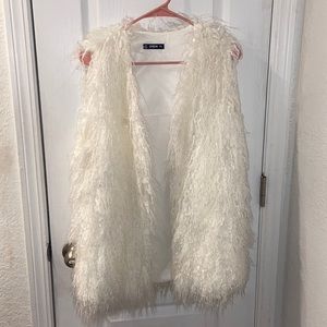 White fur vest